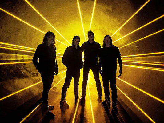 Metallica Standas in front of yellow laser beams